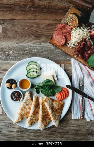 Full Turkish breakfast spread on a rustic table Stock Photo