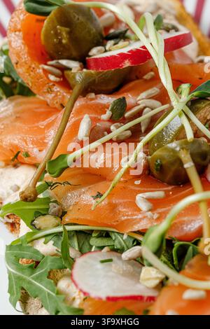 Gourmet smoked salmon toast with capers and seeds Stock Photo