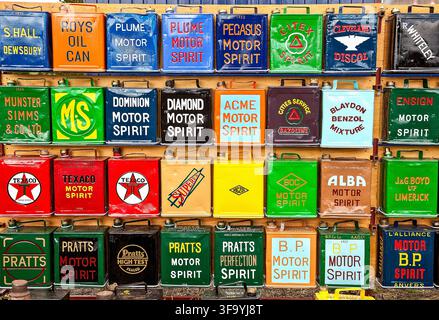 Colourful collection of collectable vintage petrol cans featuring classic motor spirit and oil brands Stock Photo