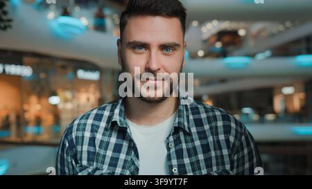 Close-up portrait Caucasian business man looking at camera smiling calm male businessman European student guy client positive smile cheerful Stock Photo