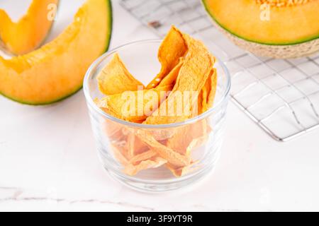 Ripe Yellow Melon Dried Jerky, Homemade  Air Fryer Dehydrated Melon slices, Raw Vegan Chewy Yellow Melons Candy, healthy fruit alternative for traditi Stock Photo