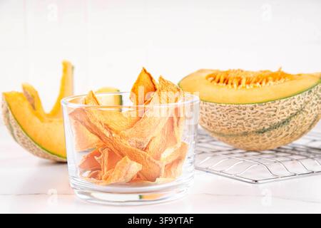 Ripe Yellow Melon Dried Jerky, Homemade  Air Fryer Dehydrated Melon slices, Raw Vegan Chewy Yellow Melons Candy, healthy fruit alternative for traditi Stock Photo