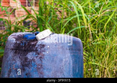 Close-up of a weathered blue gallon with the focus on the white lid on top Stock Photo
