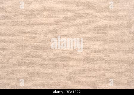 Soft beige paper texture with subtle horizontal fiber detail creates a calm abstract background for wallpaper, invitation, packaging, branding, or min Stock Photo
