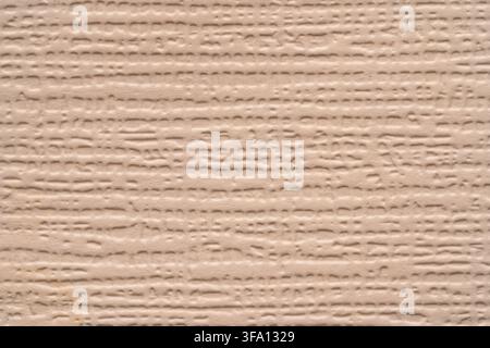 Soft beige paper texture with subtle horizontal fibers and embossed grain, creating a warm minimalist abstract background for wallpaper, packaging, st Stock Photo