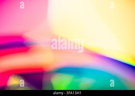 Vibrant abstract composition of neon light trails in pink, yellow, blue, green, and purple, creating a dynamic motion blur background with luminous co Stock Photo