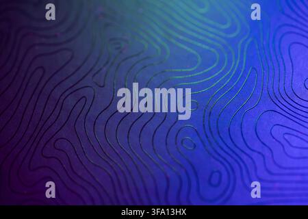 Close-up abstract background of blue and purple topographic contour lines with subtle green highlights, creating a modern textured map pattern with de Stock Photo