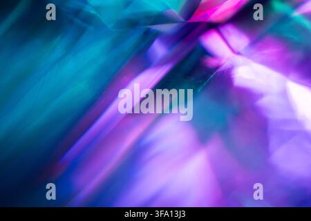 Abstract composition of luminous blue, violet, and purple light rays with soft motion blur, creating a vibrant futuristic background with glowing dept Stock Photo