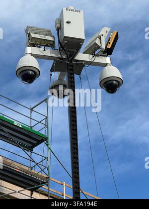 Tall pole with four cameras on it Stock Photo