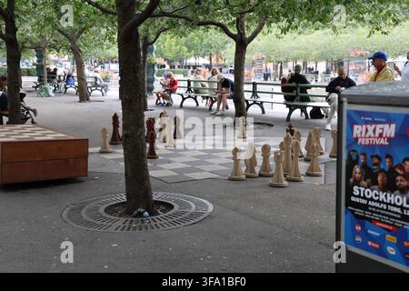 Giant outdoor chess set in Kungsträdgården park in central Stockholm, Sweden, offering recreational entertainment in an urban setting. Stock Photo