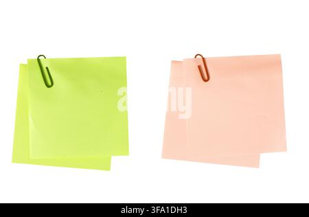 Green and orange blank sticky notes with paper clips cut out. Template mockup Stock Photo