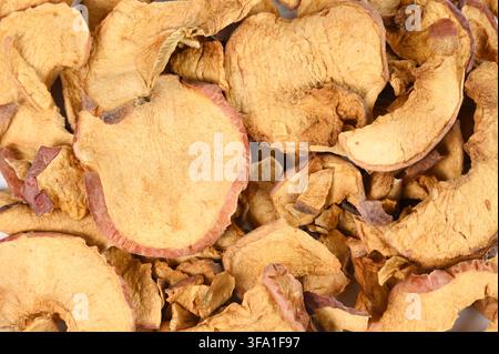 Close up of pile of dried red apples that fills entire image no white space background Stock Photo