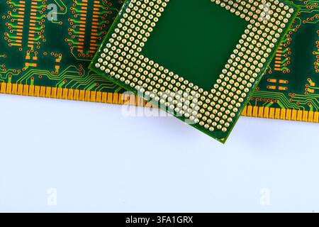 Computer chip is placed on green RAM circuit board many tracks gold pins along edges. Stock Photo