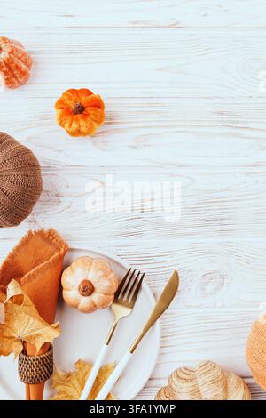 Rustic Holiday Tableware with Pumpkins and Leaves Stock Photo