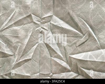 Crumpled Light Grey Fabric Texture with Wrinkles and Geometric Folds Closeup Stock Photo