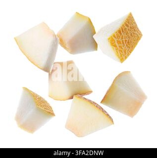 Sweet melon pieces flying in air on white background Stock Photo