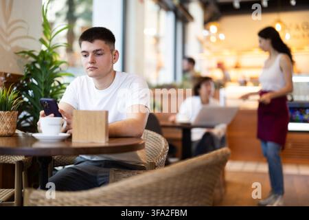 Guy talking to friends on the phone Stock Photo