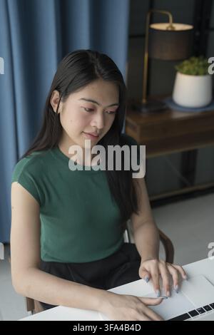 Woman working by using a laptop computer Hands typing on keyboard. writing a blog. Working at home are in hand finger typewriter Stock Photo
