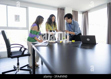 Young Business Professionals Collaborating on a Business Project in a Meeting Room Stock Photo