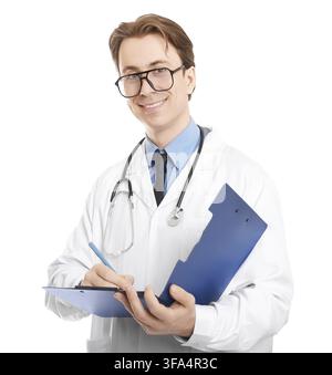 A smiling young doctor in a white coat and glasses with a stethoscope taking notes on a blue clipboard. A friendly doctor isolated against white backg Stock Photo