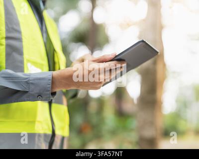 Asian engineer using tablet for digital monitoring and project management in engineering work Stock Photo