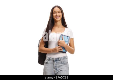 Female student holding books and walking isolated on white background Stock Photo