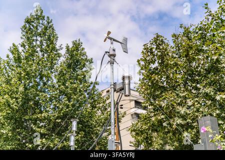 Weather station sensor mast with anemometer and meteorological equipment outdoors. High quality photo Stock Photo