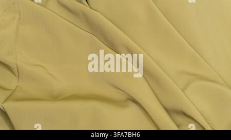 Continuous olive green textile background featuring elegant diagonal folds and a subtle silky sheen across the smooth surface. The softly draped mater Stock Photo
