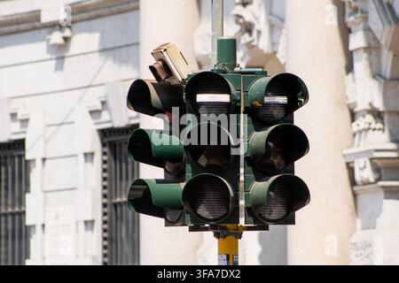 Close-up View of a Traffic Light System with Cameras on Old Historic Building Facade in Milan, Italy - June 24, 2026 Stock Photo