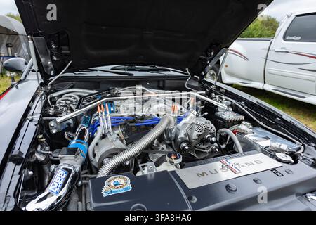 Newcastle-under-Lyme, Staffordshire-united kingdom March, 09, 2025 Detailed Close-Up Of A 3.8 Fuel Injected V6 Engine In A Classic Mustang Engine Bay Stock Photo