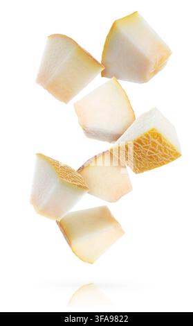 Pieces of melon flying in air on white background Stock Photo