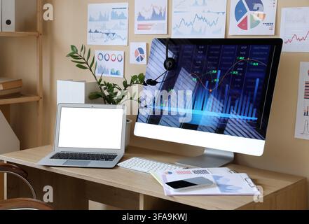Data scientists workplace with diagrams in office Stock Photo