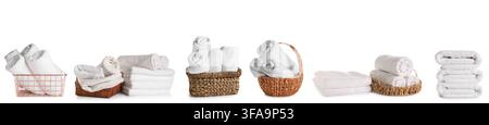 Various white towels neatly folded and rolled in baskets Stock Photo