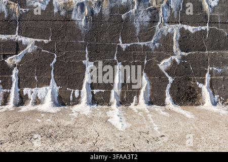 Brick wall with white saltpetre on it, potassium nitrate Stock Photo