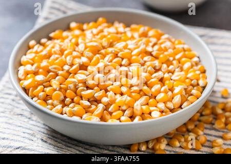 Dry Organic Raw Pop Corn Kernels in a Bowl Stock Photo
