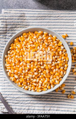 Dry Organic Raw Pop Corn Kernels in a Bowl Stock Photo