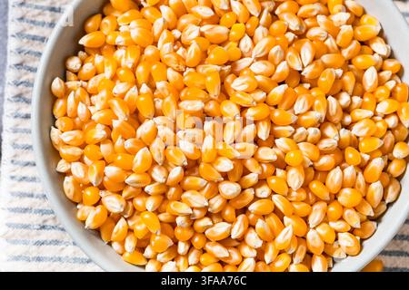 Dry Organic Raw Pop Corn Kernels in a Bowl Stock Photo