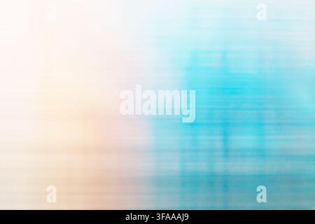 Horizontal light movement creating a blurred abstract pastel background with blue and beige tones. Stock Photo