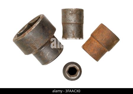 Old head wrenches on a white background. Rusty iron heads for unscrewing nuts. Stock Photo