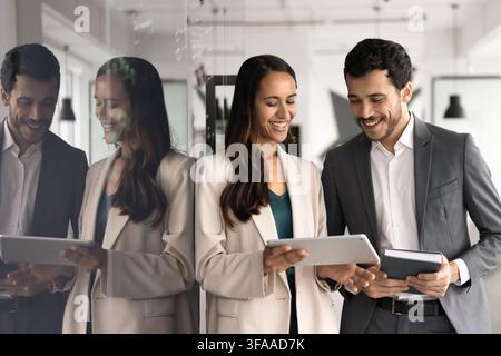 Business team reviewing information on digital tablet Stock Photo
