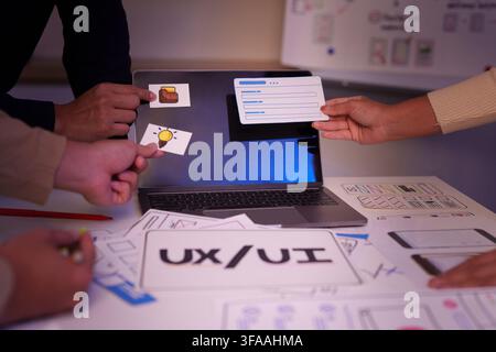 UX UI designer team placing layout elements on laptop for web application prototype Stock Photo