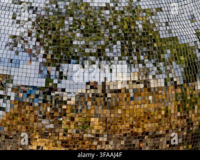 Abstract Mosaic Mirror Texture Reflecting Green Trees and Sky Stock Photo