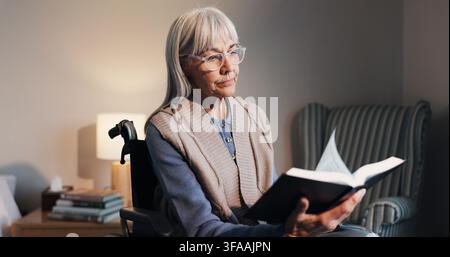 Bible, reading and senior woman in wheelchair at house for religion, worship or spiritual guide. Relax, glasses and elderly person with disability in Stock Photo