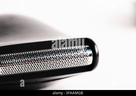 Macro shot an electric shaver head foil mesh set against clean white background Stock Photo