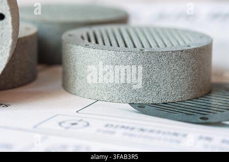 Close Up of MJF 3D Printed Prototype Component on Technical Drawing Stock Photo