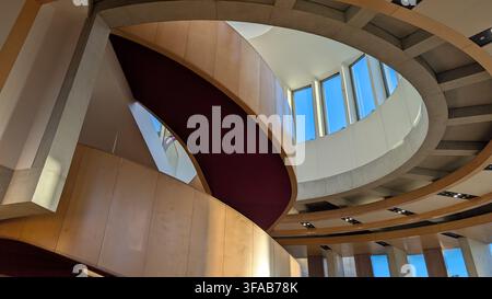Modern contemporary architectural design showing curved wooden walls and a spiral staircase at the Theatre Royal extension, Glasgow. Stock Photo