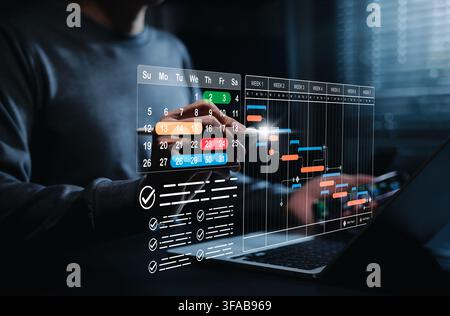 Project schedule planning and Gantt chart management concept. Businessman using laptop with calendar timeline, task checklist, weekly milestones, work Stock Photo