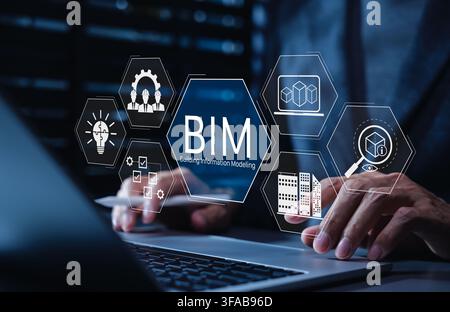 BIM Building Information Modeling Technology Concept. Hands typing on laptop with BIM tech icons, 3D modeling, architecture planning, AI, project coll Stock Photo