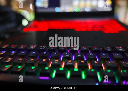 A backlit keyboard gaming computer colorful light computer keyboard electronic device desktop technology vibrant key illumination creates immersive ga Stock Photo