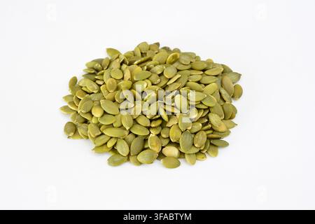 green pumpkin seeds isolated on white background, close-up Stock Photo